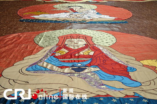 A part of the huge piece of Thangka painting [Photo/CRI]