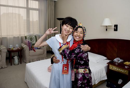 Zuojia (R) and Xuemeng pose for photo at the hotel.