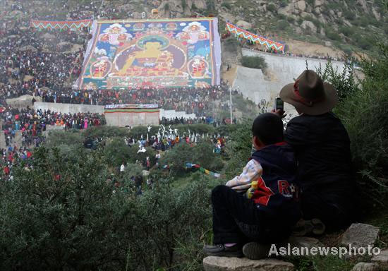 A giant Thangka painting of the Buddha is displayed near the Drepung Monastery in Lhasa, capital of the Tibet autonomous region, on Aug. 10, the first day of the Shoton Festival.