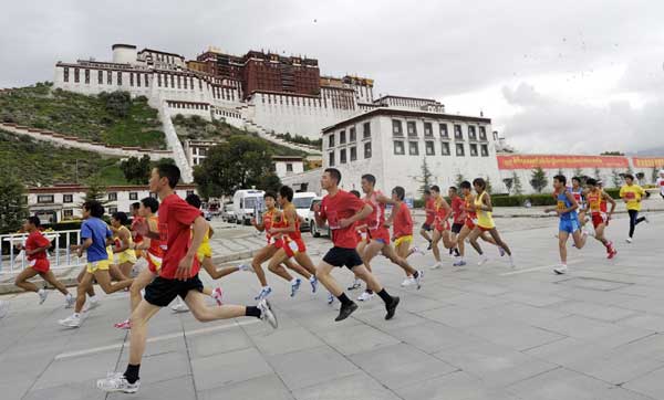 Participants in the 2010 Lhasa International Half Marathon Challenge run in front of the Potala Palace on Sunday in Lhasa, capital of the Tibet autonomous region, which is 3,670 meters above sea level.