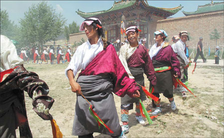 Langjia villagers dance to entertain the mountain gods during a festival.