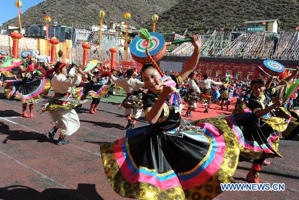 People perform traditional dances in Chamdo, southwest China's Tibet Autonomous Region, on Oct. 23, 2010. The celebration of the 60th anniversary of the liberation of Chamdo was held in Chamdo Saturday. On Oct. 19, 1950, troops of the Chinese People's Liberation Army (PLA) marched into Chamdo Prefecture, which sits in the east of Tibet and borders Yunnan, Sichuan and Qinghai provinces, and raised a Chinese national flag there. The event was a precursor to the peaceful liberation of the entire Tibet in the following year. Chamdo Prefecture, with 640,000 people, reported nearly 5.8 billion yuan (872 million U.S. dollars) of GDP last year, 140 times the 1958 figure. The per capita net annual income of local farmers and herders averaged 3,144 yuan.