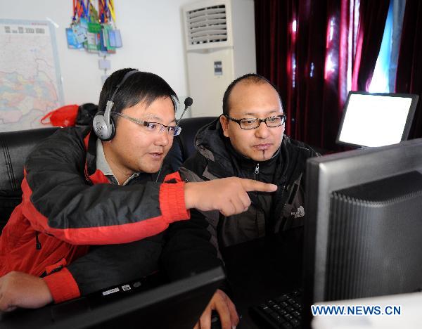 Tibetan reporters of Xinhua News Agency work on a documentary in Lhasa, capital of southwest China's Tibet Autonomous Region, Nov. 8, 2010. China celebrated its 11th Journalist Day nationwide on Monday with a variety of programs and ceremonies.