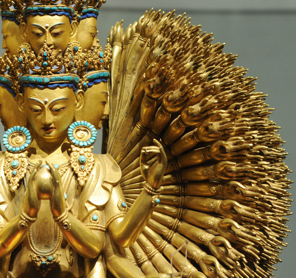 A gilt bronze statue of Guanyin, known as the Goddess of Mercy, with 11 heads, 1,000 eyes and hands, is on display at Henan Museum, July 5, 2011.
