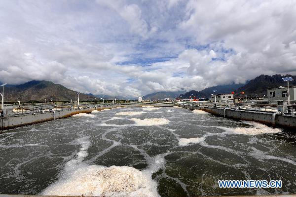 Photo taken on July 14, 2011, shows a corner of the first sewage treatment plant in Lhasa, capital of southwest China's Tibet Autonomous Region. The first sewage treatment plant in Lhasa was completed and put into test operation on Thursday. The plant adopts CAST biological treatment and has a daily sewage treatment capacity of 50,000 tons. Funded by the central governmen, the total investment of the plant is 122 million Yuan.[Photo/Xinhua]