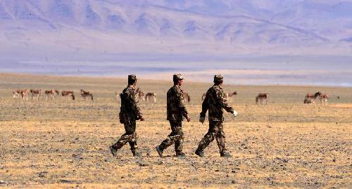 File photo taken on May 27, 2010 shows patrol members are on duty to protect wild animals in Nyima County of Ngari Prefecture, southwest China's Tibet Autonomous Region.