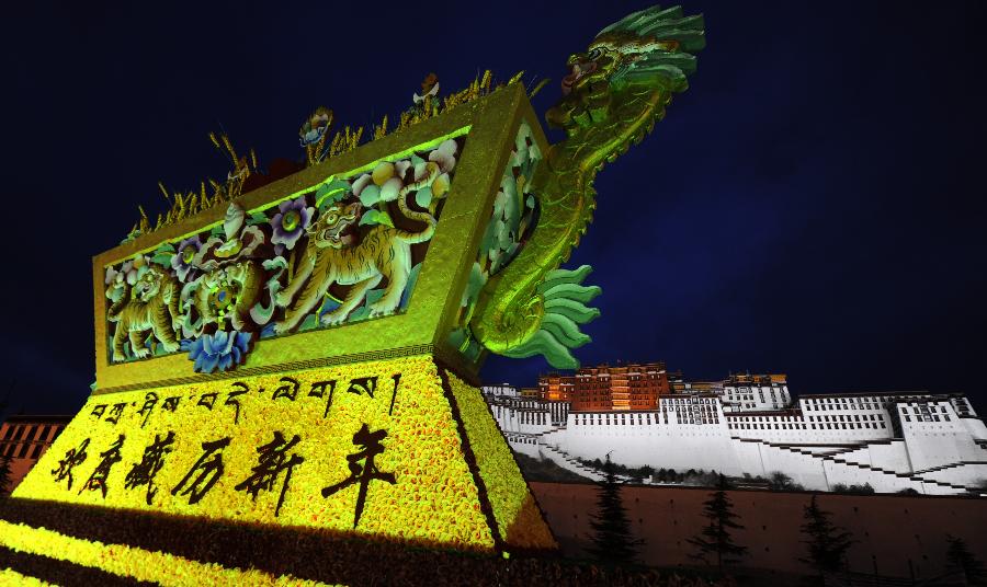 A giant "Qiema", a box of traditional Tibetan food symbolizing auspiciousness, is seen on the Potala Palace Square in Lhasa, southwest China's Tibet Autonomous Region, Feb. 19, 2012. Festive decorations are put on around the Potala Palace as Losar, or the Tibetan New Year, approaches.