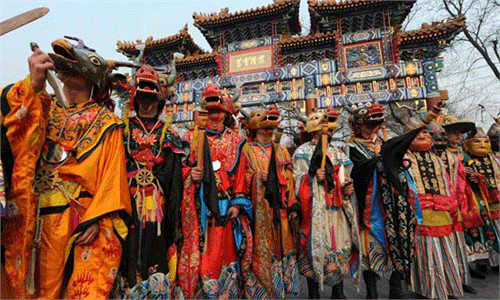 Tibetan monks dressed as demons perform during a Tibetan New Year ceremony at the Yonghe Temple, also known as the Lama Temple, in Beijing Tuesday. Tibetan New Year is usually a time for festivities in the country’s ethnically Tibetan areas. Photo: AFP