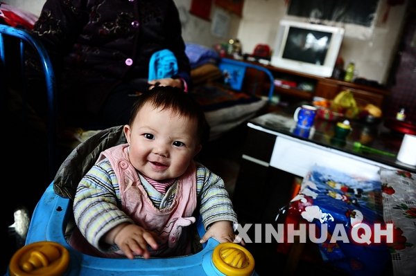 1-year-old Rinchen Yangqen is in his home.