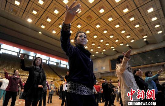 Residents practice Tachi in a training class at Tibet Gymnasium in Lhasa on April 21, 2012.