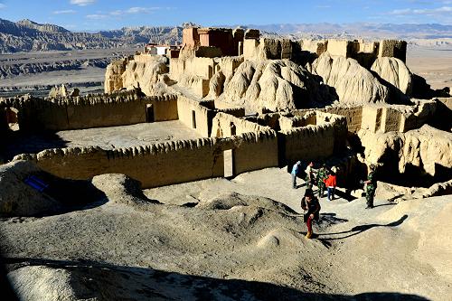 Tourists are visiting the Ruins of Guge Kingdom. Located at an elevation of 4,500 meter in Zanda County of the Tibet Autonomous Region, the Ruins of Guge Kingdom is reputed as "the Roof of the World’s Roof". Established in around the 10th century, the Guge Kingdom was founded by one branch of a nearby fallen kingdom. [Photo/ Xinhua]