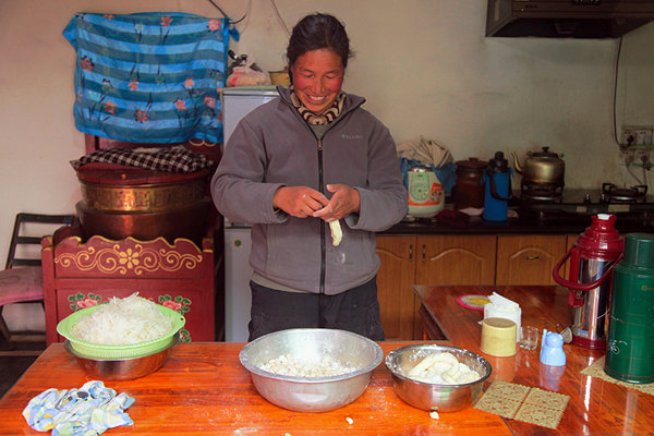 Photo shows that a Tibetan housewife prepares to c