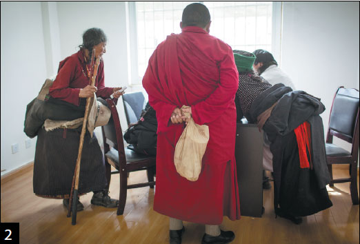 Tibetan patients listen to a doctor from Beijing.