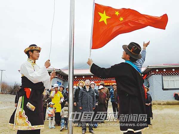 Tibetans hold a flag-raising ceremony to celebrate Tibetan Serfs Emancipation Day in Mainiangmai Village, Menri Township, Nyingchi County, Nyingchi Prefecture, southeast Tibet Autonomous Region on March 27, 2012. [Photo/Chinatibetnews.com]